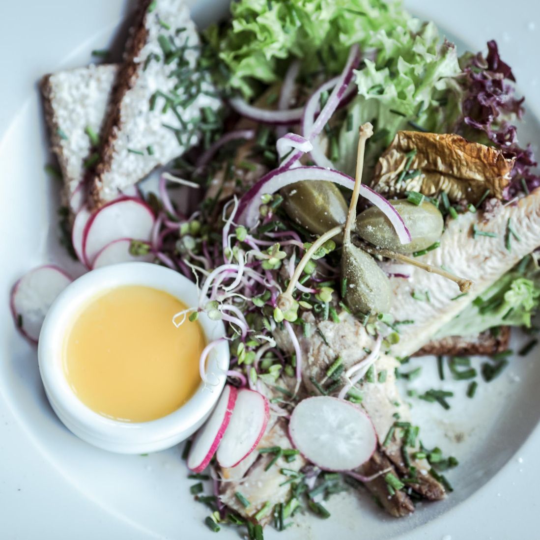 Sun over Gudhjem. Quality ingredients served on a plate at Café Klint in Gudhjem.