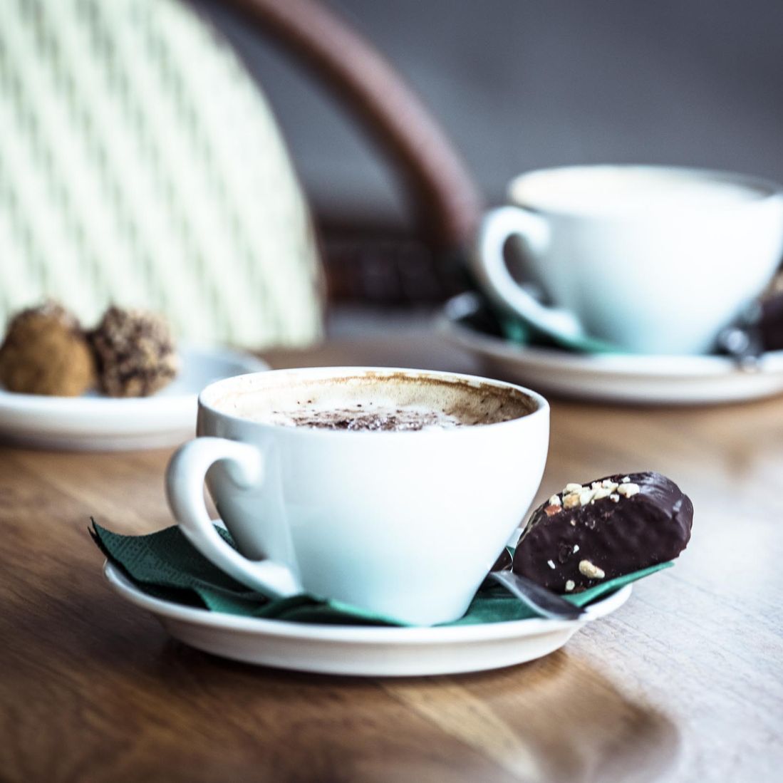 Cappuccino with chocolate bite from BECH Chocolate at Café Klint in Gudhjem.